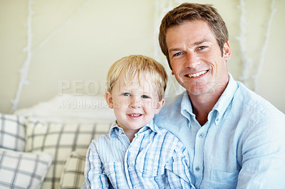 Buy stock photo Happy, portrait and dad with son in home for bonding, relationship and love for fathers day. Family, smile and man with kid on couch for connection, support and relax together on weekend in house