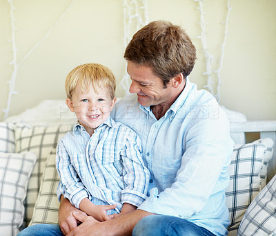 Buy stock photo Childcare, dad and son in house with hug, healthy relationship or bonding together for child growth. Portrait, smile or family with embrace, happy connection or parent love in childhood development.