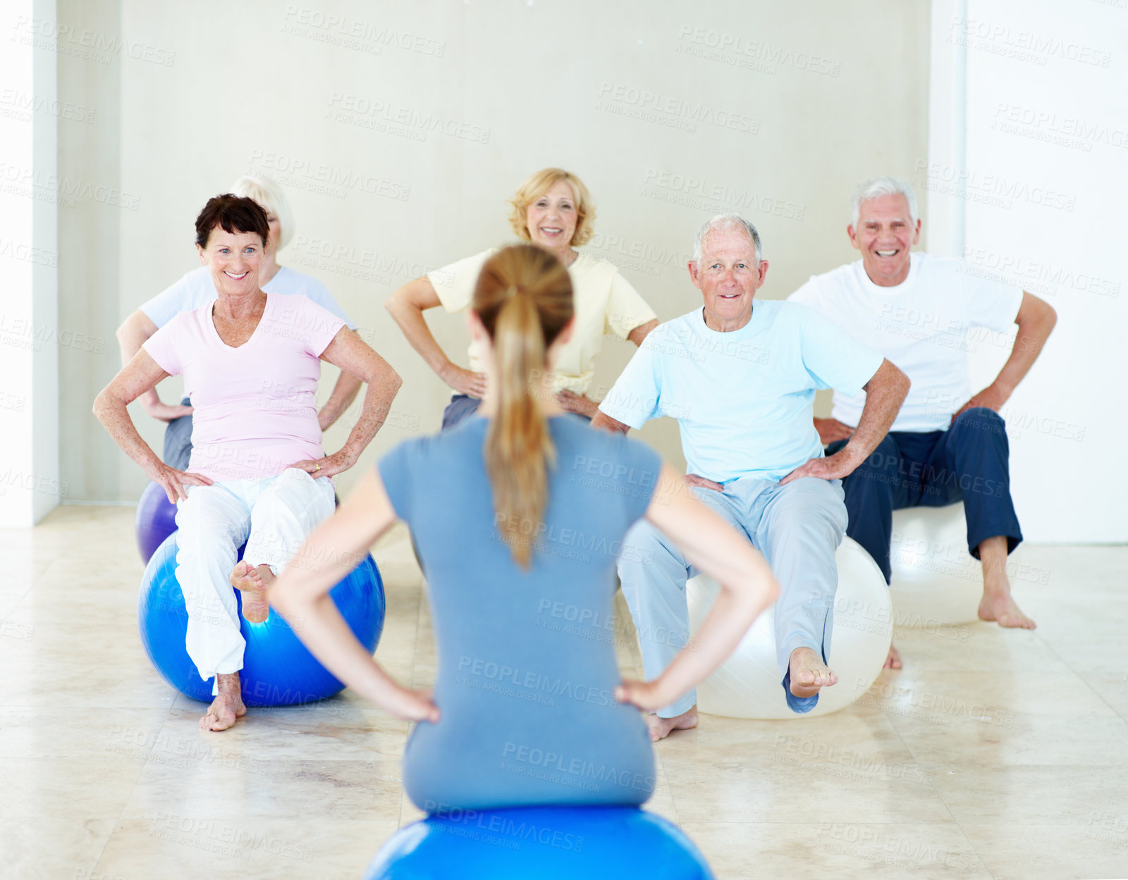 Buy stock photo Woman, stretching and instructor in yoga studio, fitness and exercise together for holistic healing. People, meditation and coach training for spiritual health, movement or back for wellness or calm