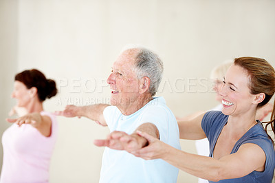 Buy stock photo Senior people, help and fitness coach in exercise class for balance, wellness and active retirement. Woman, happy group and instructor for teaching, stretching and together for health in old age