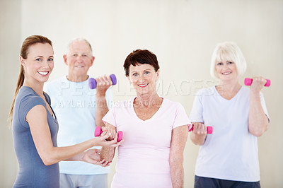 Buy stock photo Pilates, instructor and elderly people in portrait with dumbbells, support and fitness in retirement. Senior group, trainer and weights at facility for teaching, muscle development and exercise class