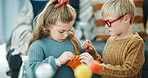 Children, science and toy with model for project, education or assignment with bonding in house. Learn, student and siblings with inspection for development, school homework or play in apartment