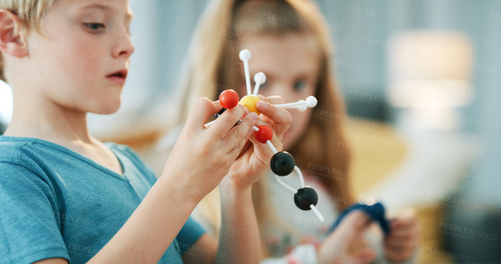 Buy stock photo Boy, science and play with atom model for project, discovery or assignment. Learning, educational toy and siblings with inspection of molecule, particle or element for school homework in house