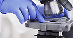 Hands, microscope and dna with science for virus cure, review or medical research for healthcare innovation. Person, equipment and film for bacteria, particle or pharma study for vaccine development