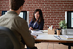 Business woman talking to colleague in office