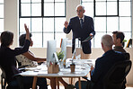 Senior businessman meeting colleagues discussing ideas business woman asking question with hand raised in office