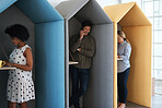 Business people working in colorful office cubicles in workplace