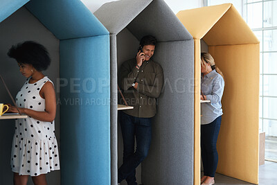 Buy stock photo People, business and booth with technology for workspace isolation, privacy or hybrid work. Group, employees or colleagues with laptop or smartphone in worker cubicle for seclusion or distance