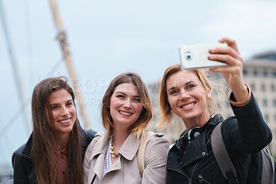 Buy stock photo Smile, selfie and women in city for travel, photography and social media post on holiday. Happy, friends and bonding in town for profile picture update, getaway gathering and memory on vacation trip