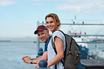 Travel couple on vacation sightseeing in harbour watefront happy tourists on holiday