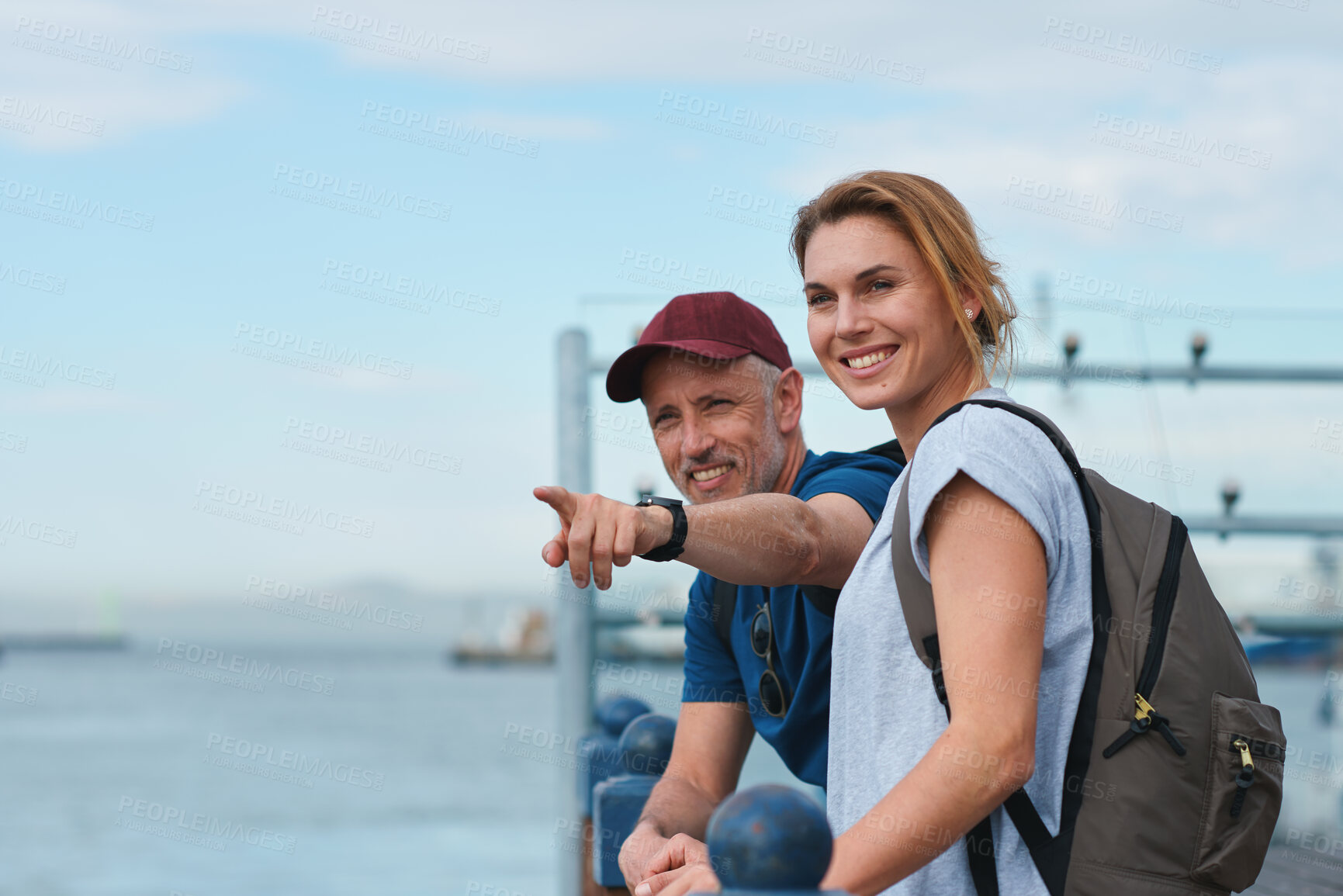 Buy stock photo Couple, travel and pointing in harbor for holiday, date and smile for summer sightseeing or bonding. Mature man, woman and tourist with trip, vacation and view together for honeymoon on waterfront