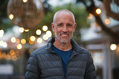 Buy stock photo Night, portrait and man with travel for festival, holiday experience and abroad for weekend getaway. Bokeh, evening and mature person with smile for tourism, overseas vacation and local winter event