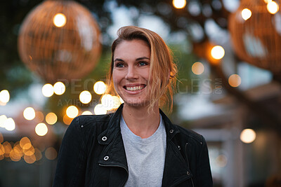 Buy stock photo Night, thinking and happy woman in city with travel, lights and vision for weekend break outdoor. Bokeh, female person and explore downtown with wellness, good mood and reflection for calm evening.