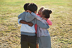 happy children hugging having fun playing in park
