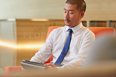 Buy stock photo Tablet, office and Asian man with business review, financial records or check email for budget. Tech, workplace and mature banker reading report for investment expenses, asset management or schedule