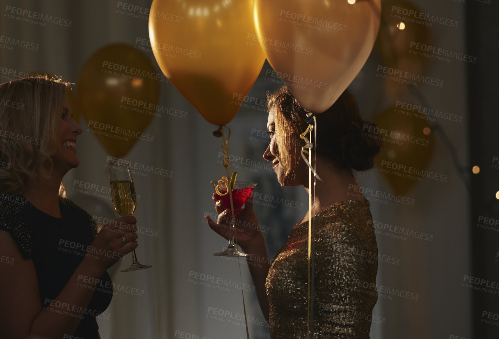 Buy stock photo Night, friends and women with alcohol at event, birthday celebration and gossip at social gathering. Evening party, talking and happy people with drinks for get together, bonding and weekend reunion