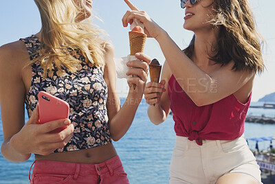 Buy stock photo Beautiful Tourist girls eating ice cream on beach having fun treat on vacation enjoying freedom