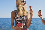 Beautiful Tourist girls eating ice cream on beach having fun treat on vacation enjoying freedom