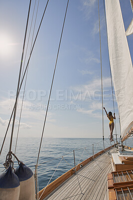 Buy stock photo Travel, ocean and woman on boat for holiday, vacation or getaway in summer with luxury sailing. Sea water, blue sky and female person on yacht for journey, sunbathing and transport on weekend trip.