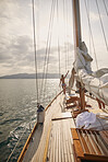 Beautiful woman on sailboat in bikini in ocean on luxury summer lifestyle happy adventure travel vacation
