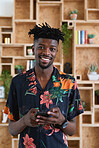 Portrait happy african american man using smartphone smiling holding mobile phone success testimonial