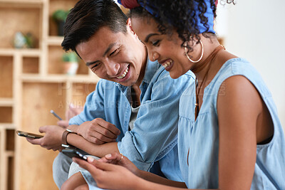 Buy stock photo Laughing, phone and sharing with couple in home together for bonding, love or social media. App, funny and text message with happy people in living room of apartment for connection or meme search