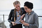 Girl friends using smartphone browsing online sharing social media messages on mobile phone