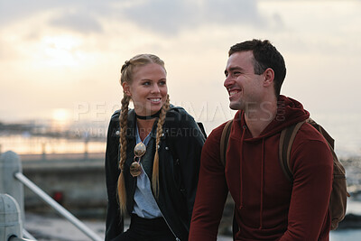 Buy stock photo Outdoor, sunset and couple with smile for holiday, weekend break and getaway trip for connection. Evening bonding, love and people with travel for abroad adventure, tourism and vacation for happiness