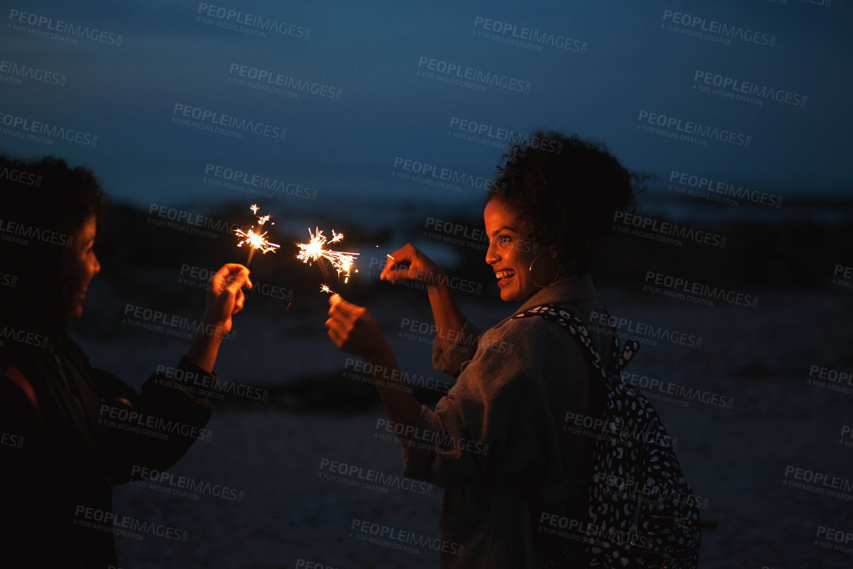 Buy stock photo Party, friends and women with sparkler outdoor for celebration, social gathering and laugh together. Funny people, fireworks and hang out in nature for new year, festive season or excited at night