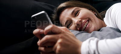 Buy stock photo Smile, relax and woman in bed with phone, text or reading funny meme on social media in home. Laugh, chill or person in bedroom on mobile app for typing message, morning notification or communication