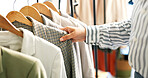 Hands, jacket and woman in store with choice, decision and shopping for retail therapy with fabric quality. Fashion, design and female customer in boutique with discount, deal or sale for blazer.