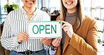 Hands, open sign and women in small business boutique for commerce, retail or teamwork. Collaboration, glass door and smile with happy employees at shop entrance together for management of startup