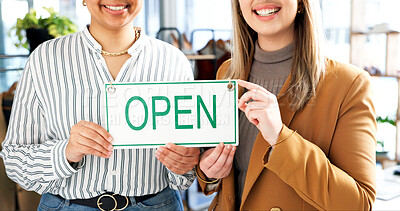 Buy stock photo Hands, open sign and women in small business boutique for commerce, retail or teamwork. Collaboration, glass door and smile with happy employees at shop entrance together for management of startup