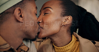 Buy stock photo Love, cafe and black couple with kiss on date for celebration, anniversary or honeymoon on holiday. Vacation, happy woman and man in restaurant for care, trust or support with romance together