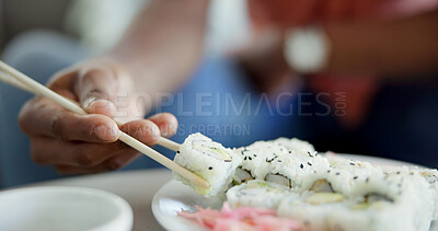 Buy stock photo Hand, chopstick or sushi in home for lunch, Japanese cuisine or roll selection in living room. Hungry person, rice meal or pickled ginger on dish for appetizer, seafood catering or nutrition in house