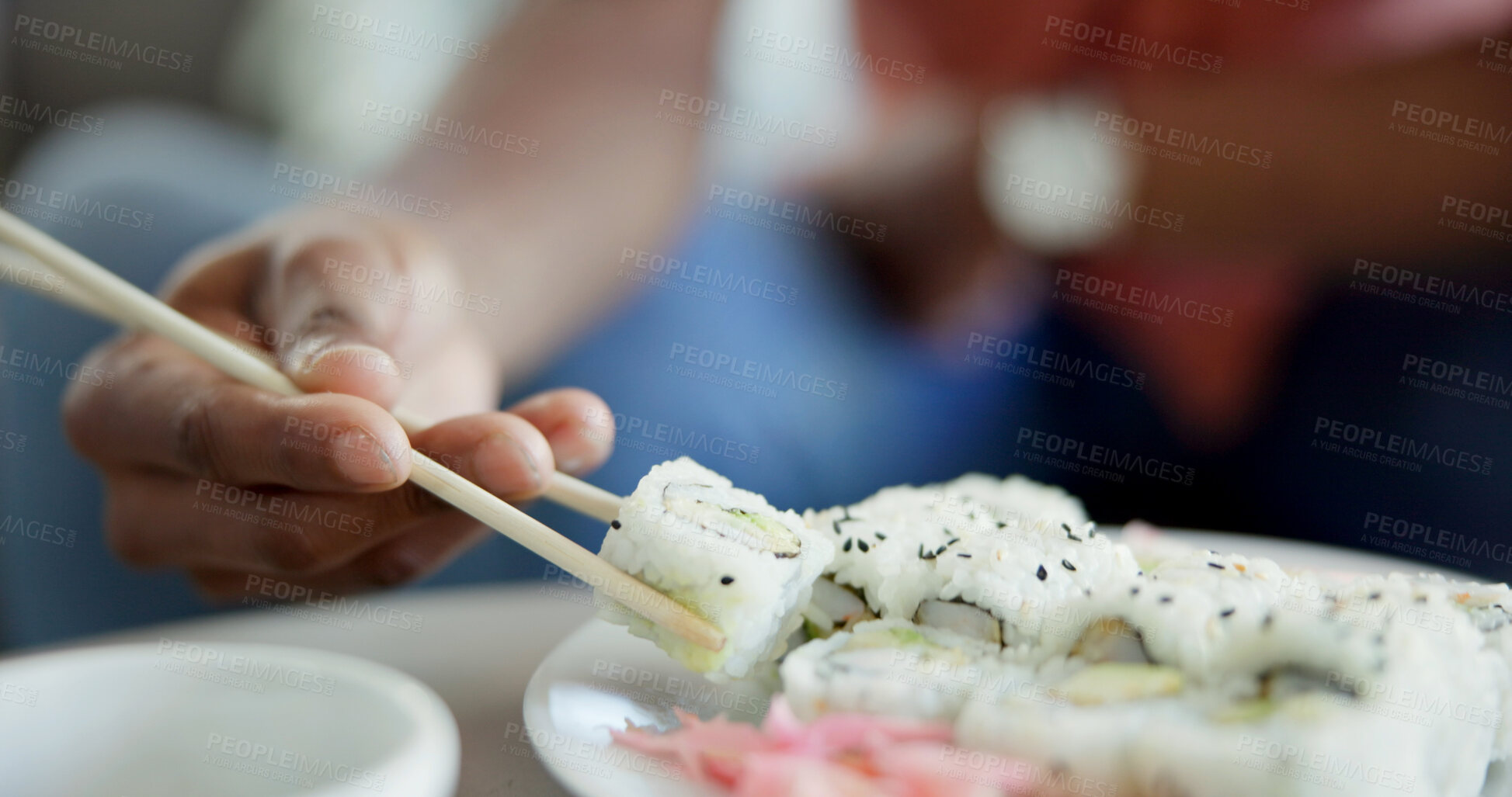 Buy stock photo Hand, chopstick or sushi in home for lunch, Japanese cuisine or roll selection in living room. Hungry person, rice meal or pickled ginger on dish for appetizer, seafood catering or nutrition in house
