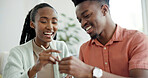 Smile, couple and learning at house with chopsticks, technique and assistance for new skill. Happy, black people and help with sticks for dining etiquette, Japanese customs and bonding for tradition