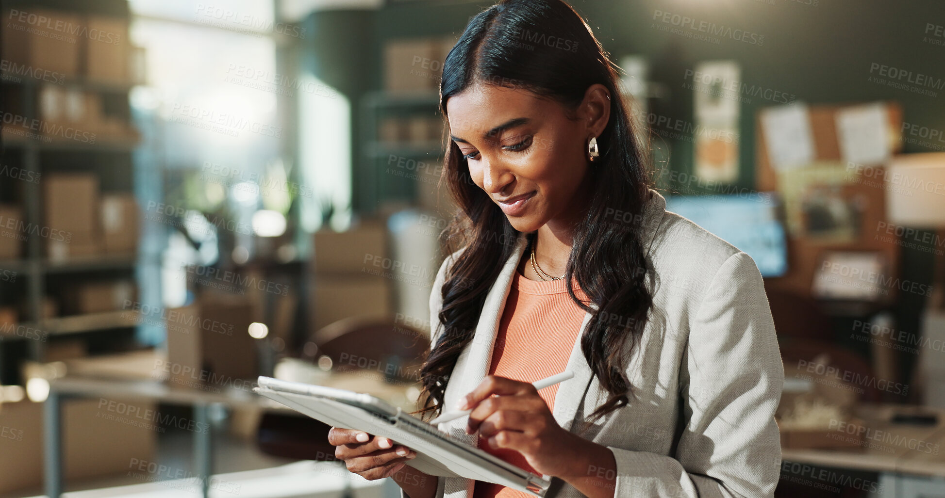 Buy stock photo Ecommerce, woman and writing in office with tablet, administration or inventory management report. Happy, person and stylus in small business with tech, logistics update or notes for courier delivery
