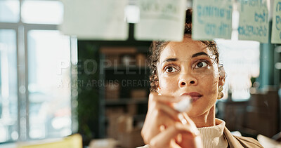 Buy stock photo Glass wall, planning and writing with woman in logistics warehouse for shipping strategy. Ecommerce, maker and storyboard with employee in supply chain office for delivery or distribution tracking