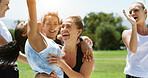 Fitness, women and hug with group for win, celebration and solidarity outdoor for competition. Excited, people and athlete team together for bonding, exercise and smile for success with tournament
