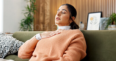 Buy stock photo Woman, relax and breathe in home for meditation, spiritual healing and zen with holistic balance. Person, rest or eyes closed on sofa with breathwork, inner peace and inhale technique for mindfulness