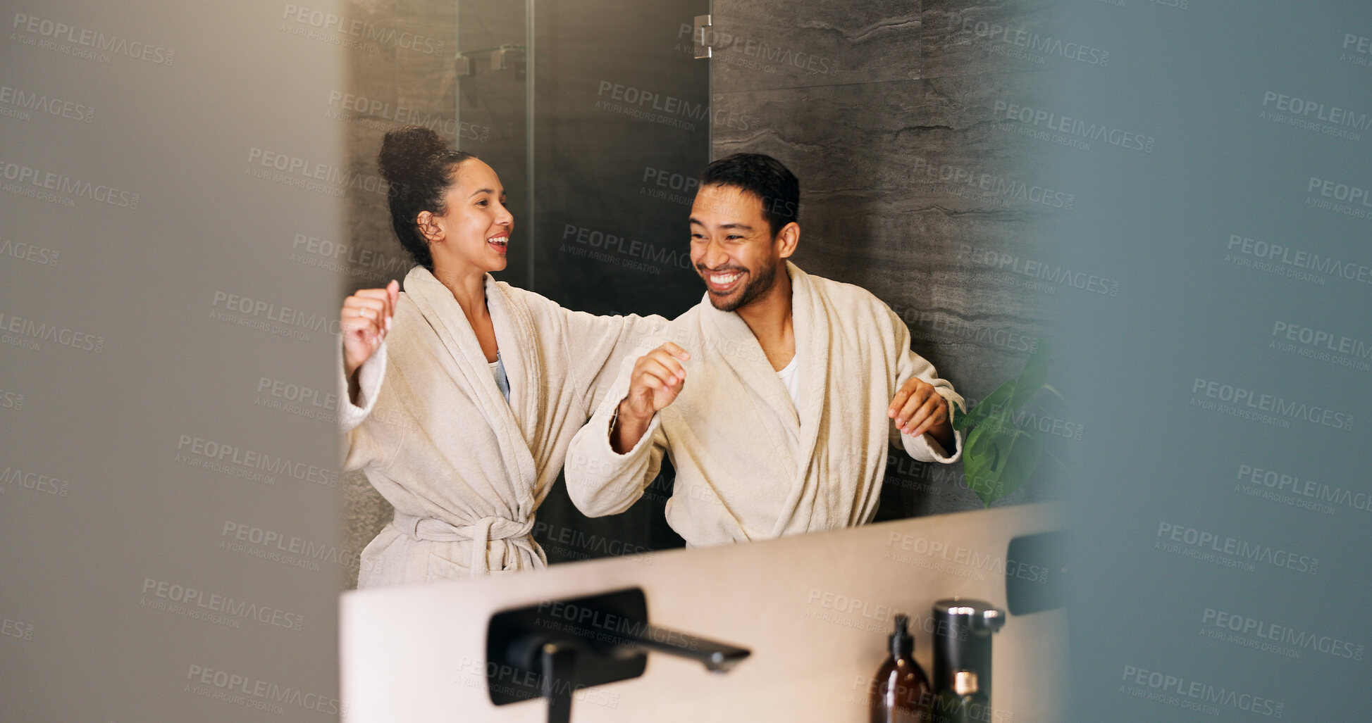 Buy stock photo Bathroom, happy couple and dance by mirror for love, morning routine and bonding together. Excited people, music and rhythm in home with reflection, hygiene and relationship wellness with space