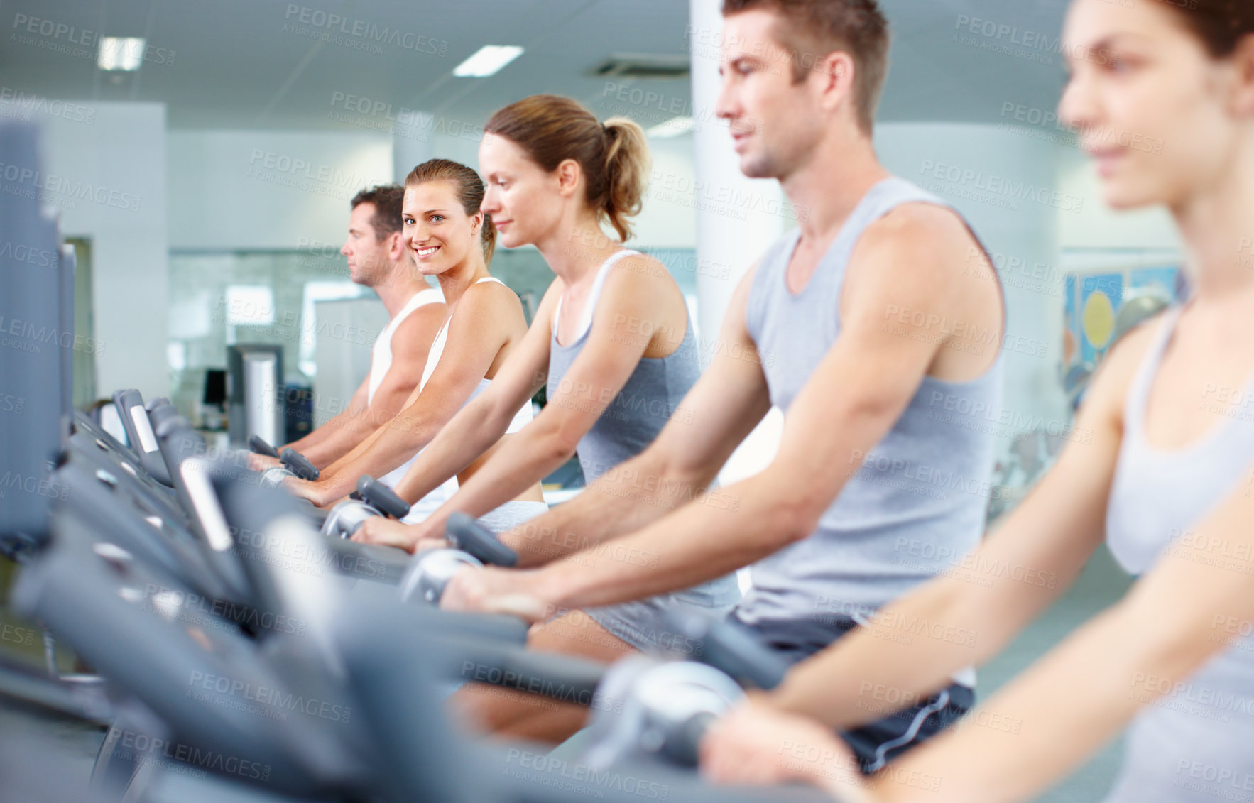 Buy stock photo Gym, fitness and happy woman on exercise bike, self care and training for muscle strength or health. Cycling, portrait and people on cardio machine, endurance and lose weight with workout routine
