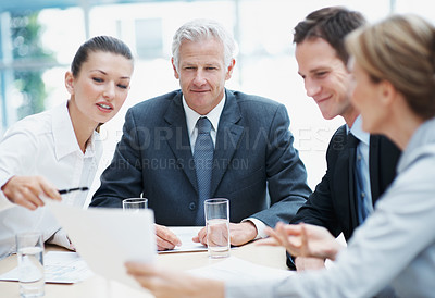 Buy stock photo Corporate, meeting and business people in office with paperwork, manager review and budget advice. Team, management and discussion in audit firm with documents, collaboration and financial planning.