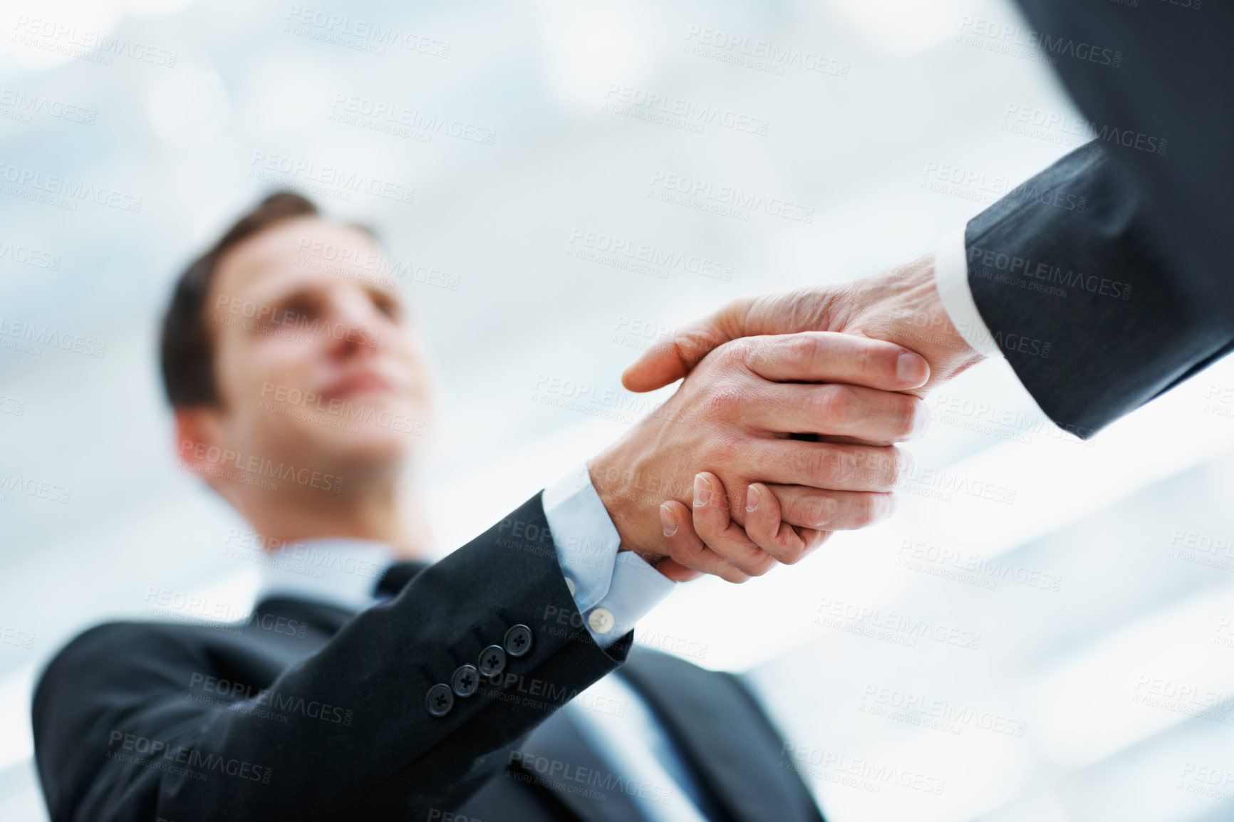 Buy stock photo Handshake, partnership and business man in office with financial merger, collaboration or agreement. Shaking hands, low angle and people with investment acquisition, deal or corporate consolidation