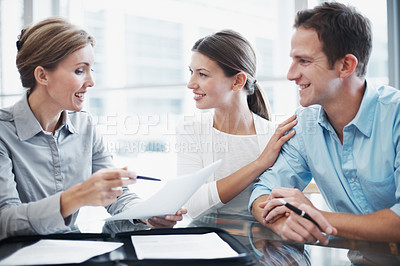 Buy stock photo Finance, happy couple and document in meeting with consultant, insurance update and holding hands. Paperwork, married people and broker in office for investment guide to qualify for premium cover