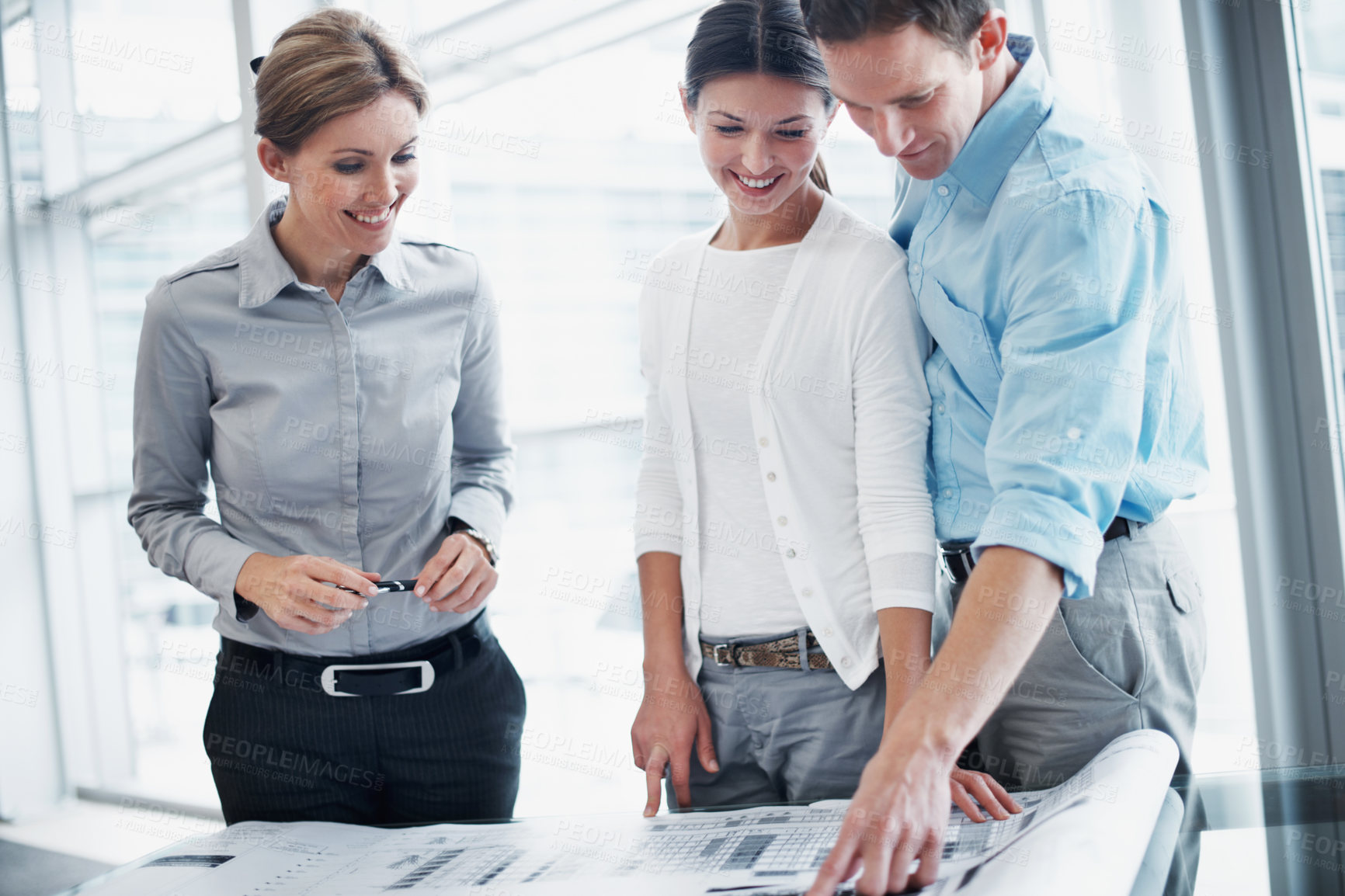 Buy stock photo Architect, couple and review blueprint with clients, design decision or budget planning for renovation. Happy people, document and consultation with layout, construction or development cost in office