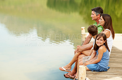 Buy stock photo Parents, kids and pier by river with summer holiday, relax and bonding together for weekend break. Mockup space, mother and father outdoor by lake with children, vacation and happy family portrait.