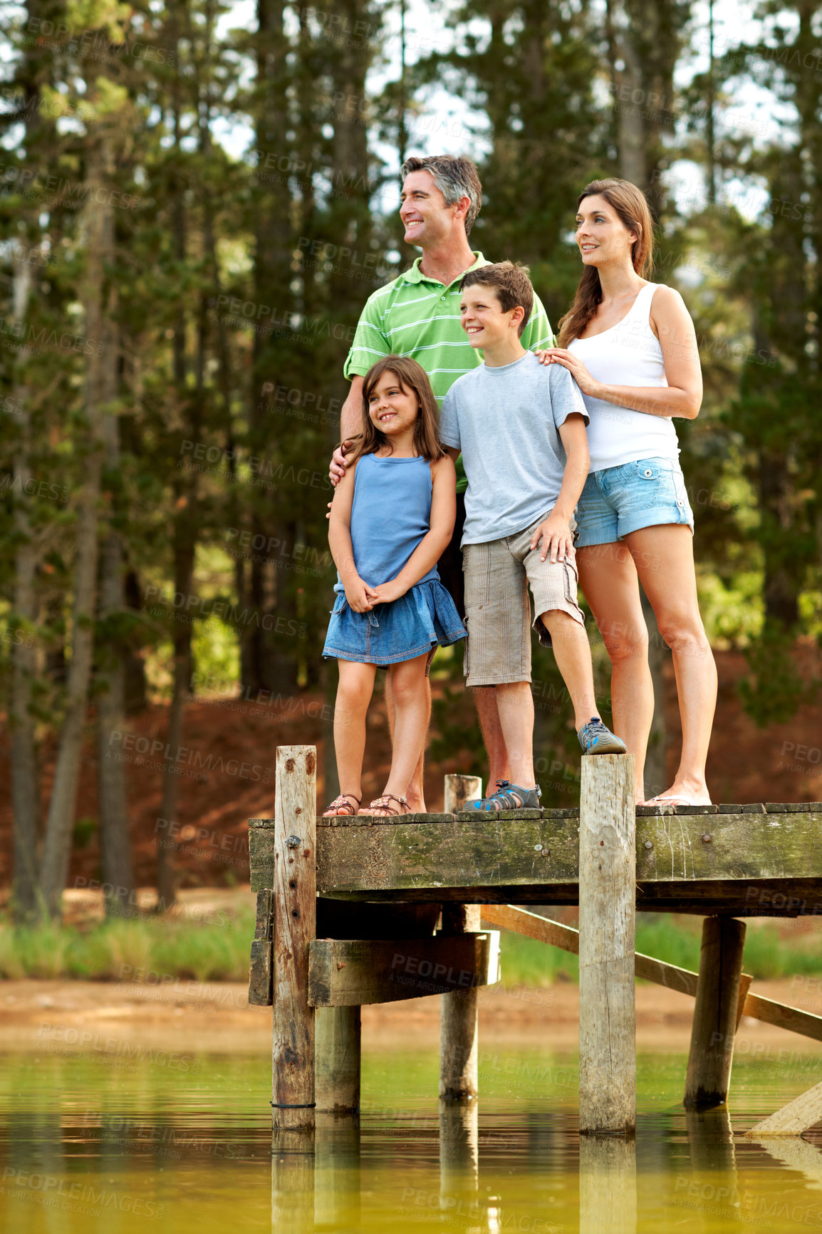 Buy stock photo Thinking, family and happy by lake in countryside for summer holiday, vacation and together. River, pier and smile of man, woman and children in nature to relax, bonding and connection or love