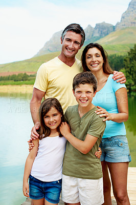 Buy stock photo Holiday, parents or children at river with portrait, bonding together or connection on summer vacation. Smile, siblings or family with love, happy moment or healthy relationship on lake getaway.